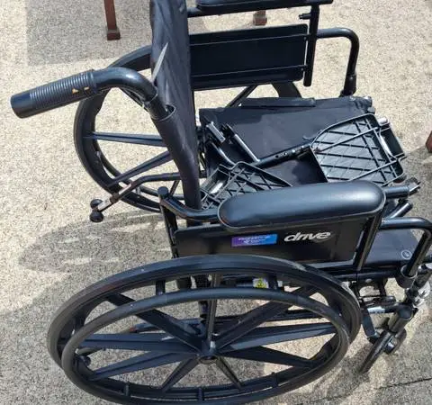 WHEELCHAIR WITH LEG RESTS