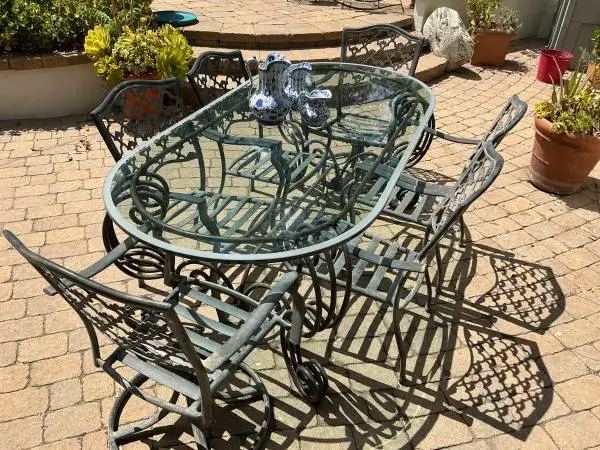 Patio table and 6 chairs with beveled glass top