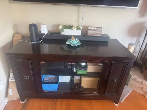 Dark Wood TV Stand with Glass Doors and Pull-Out Media Storage