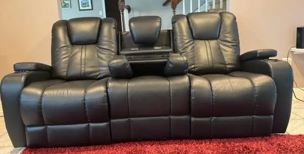 Black leather power reclining sofa plus matching loveseat