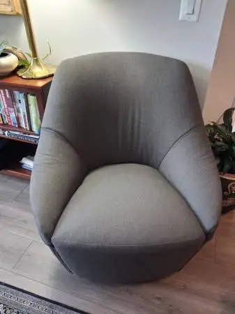 Revolving arm chair by Calligaris
