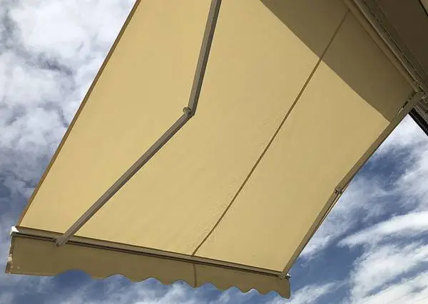 Motorized retractable patio awning