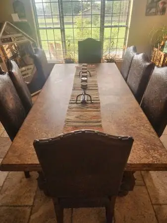 Granite Dining Room Table and Hand tooled Leather Chairs