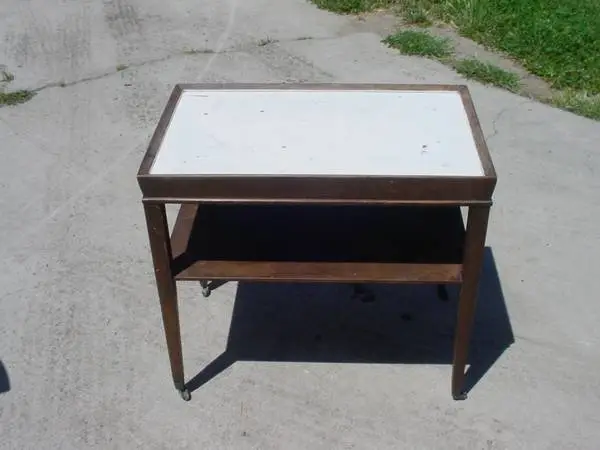 vintage end table on metal casters