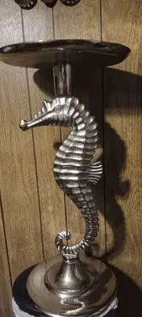 2 silver chrome seahorse side tables27 inch tall. $75 both or $40 each both
