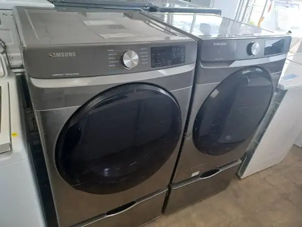 Samsung Grey Front Load Washer/Electric Dryer Set On Pedestals
