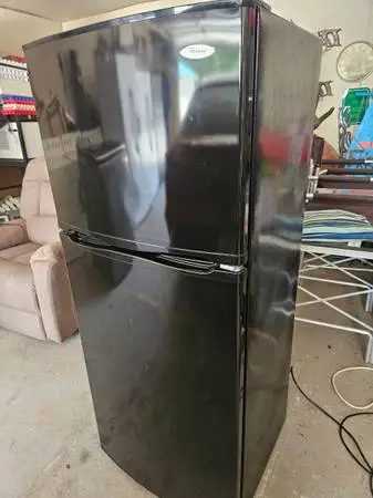 Whirlpool fridge freezer on top plugged up working