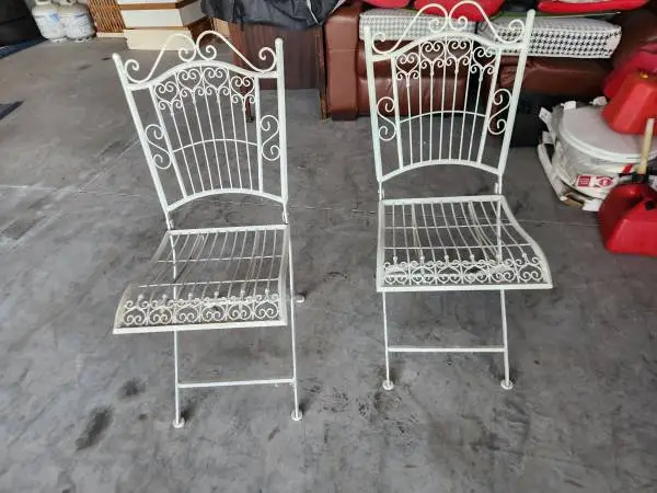 Two very nice vintage folding iron chairs