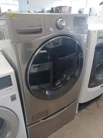 LG Grey Front Load Electric Washer On Pedestal