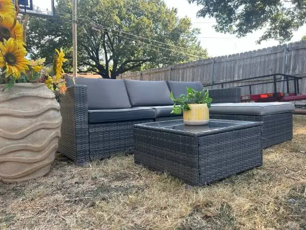 Outdoor patio sectional with table and glass top