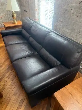 (2) Leather Sofas and (1) Oversized Leather Chair W/ Matching Ottaman