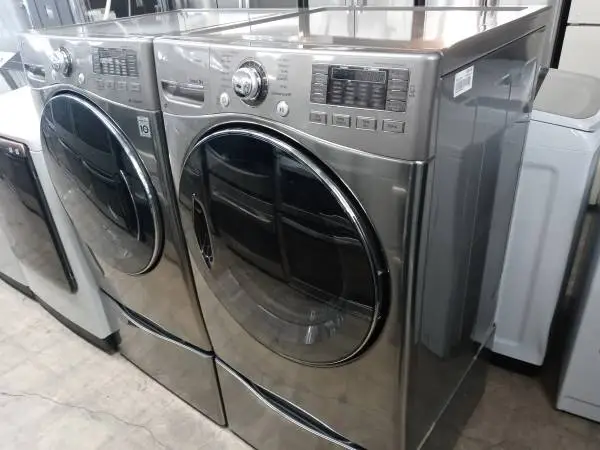 ★LG gray front load washer and gas dryer set on pedestals
