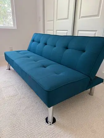 Turquoise sleeper sofa with charger