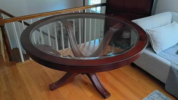 Large contemporary glass table with fancy polished wood base