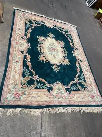 Vintage green floral wool area rug