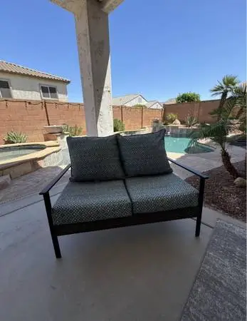 Patio bench with cushions