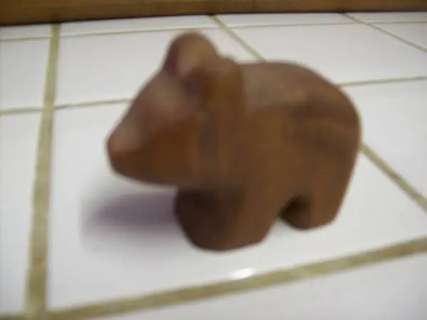 2 small carved wooden figures - pig and bear