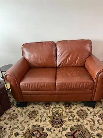 Soft brown leather love sofa