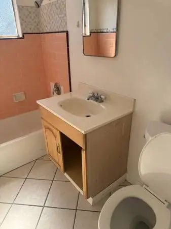 Bathroom vanity with sink and faucet