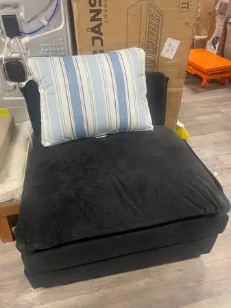 Black Soft Chair with Blue & White Striped Pillow