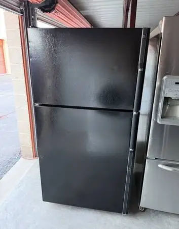 Black GE Refrigerator And Freezer