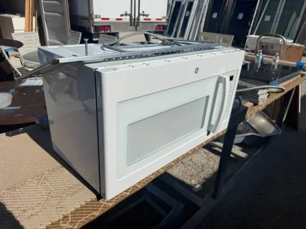 White GE Microwave Over The Range 1.6 Cu Ft Model # JVM3160DF2W Used