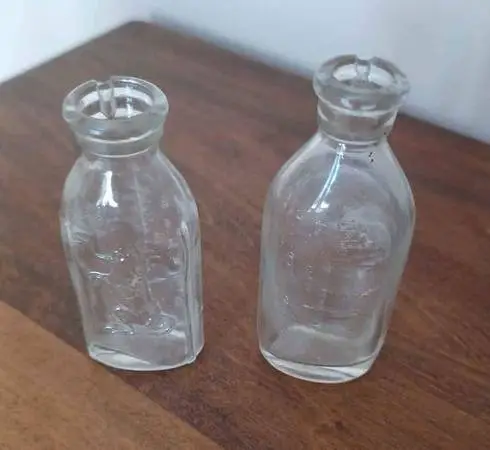 GLASS EMBOSSED BABY DOLL BOTTLES -