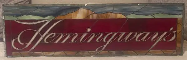 Hemingway’s Stained Glass Pub advertising sign.