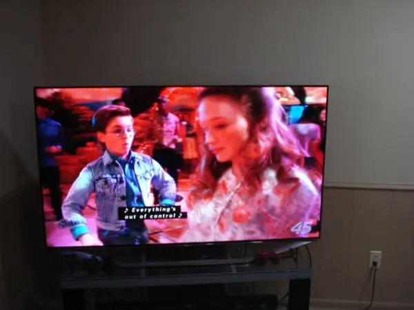 ** Samsung UN65H7150 65-inch TV with remote