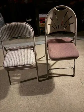Two padded folding chairs