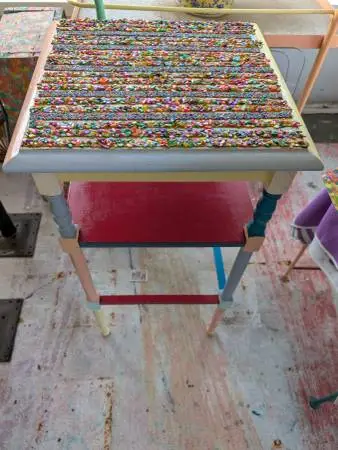 HAND PAINTED TABLE WITH STRIPED MATERIAL AND PLEXIGLAS ON TOP