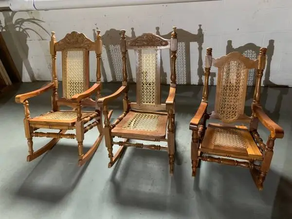 Three wooden caned rockers