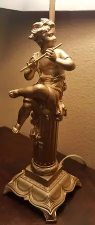 Antique cast iron lamp with angel sculpture