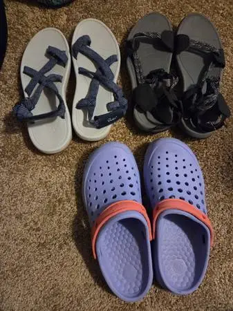 Numerous pairs of new sneakers sandals clogs boots tennis shoes etc