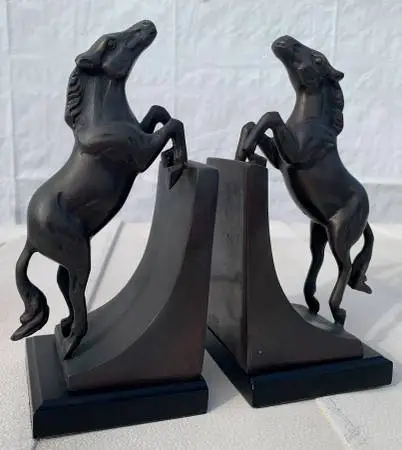 Vintage solid brass bookends with jumping horses
