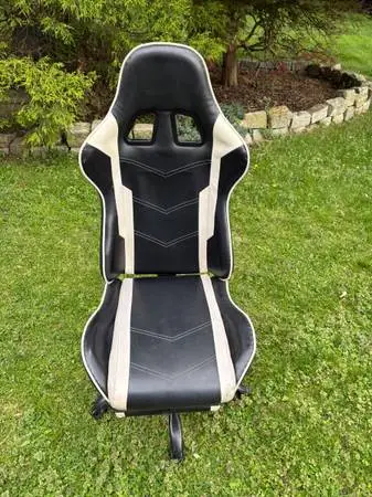 High back adjustable racing style gaming chair with foot rest