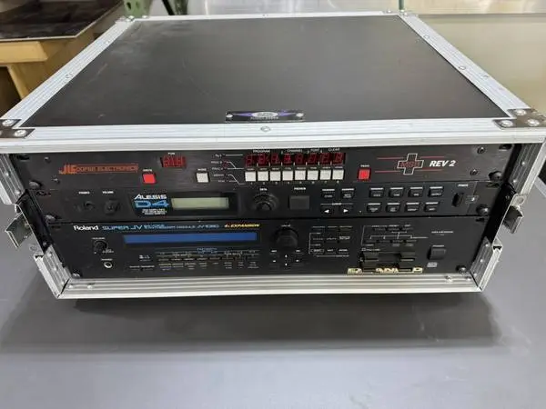 Studio gear rack units, synth, drum module, midi patch bay