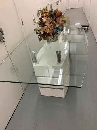 A glass top dining table