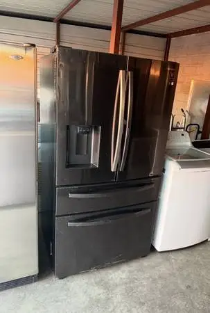Dark Stainless Steel Samsung Refrigerator And Freezer