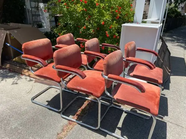 Six modern red leather dining chairs