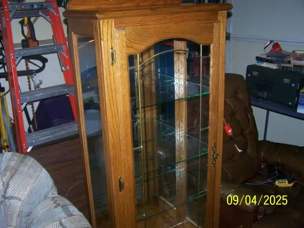 All wood and glass curio case.