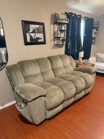 Grey plush reclining sofa