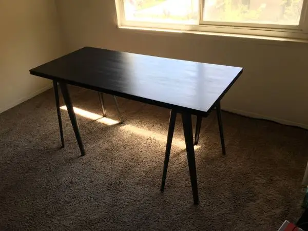 Black Ikea computer desk / workstation table