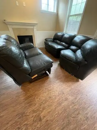 Black leather Ashley sectional & Barnhart Chair