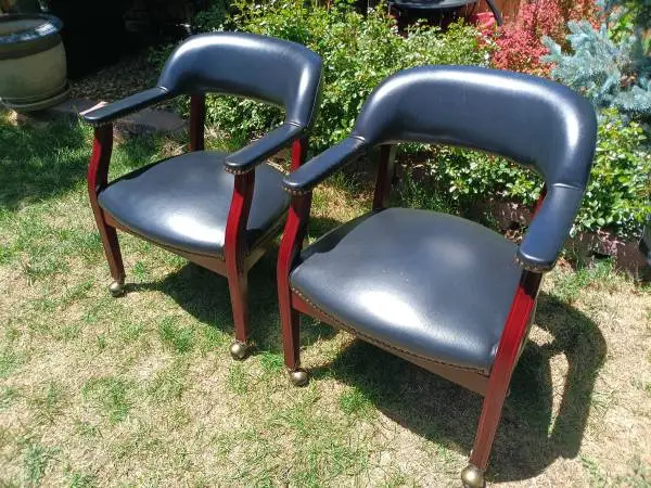 Pair Of Leather Rolling Chairs On Wheels