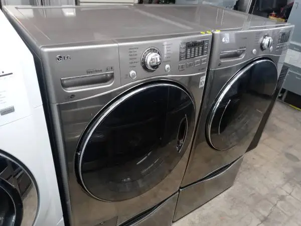 ★LG gray front load washer and gas dryer set on pedestals