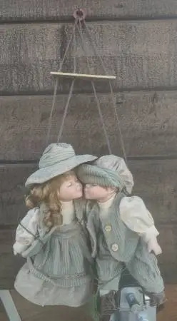 Porcelain Vintage 12 inch Children Kissing on a Swing