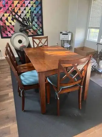 Solid wood dining table (with leaf) and four chairs