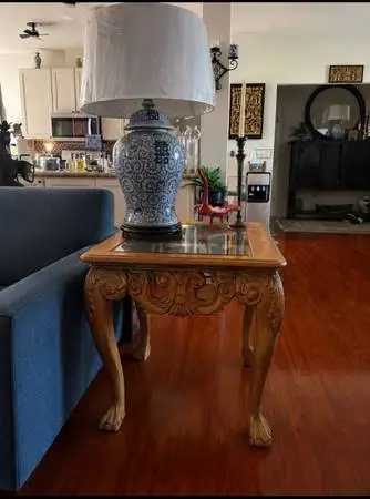 Beautiful pair of ornate end tables featuring detailed carved scrollwork, elegan