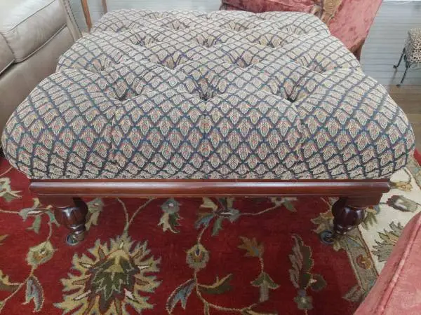 Elegant Ottoman with Tufted Fabric, Wood Legs and Wood Trim